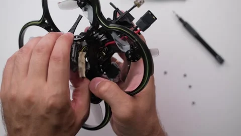 Technical specialist assembly fpv drone screw video transmitter air unit Stock Footage 244336154