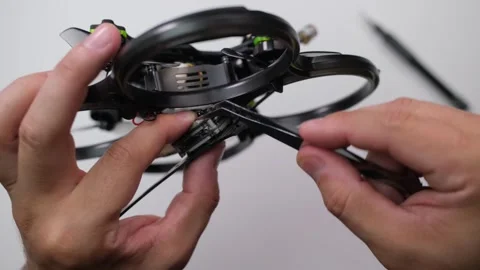 Technical specialist assembly fpv drone screw video transmitter air unit Stock Footage 244336212