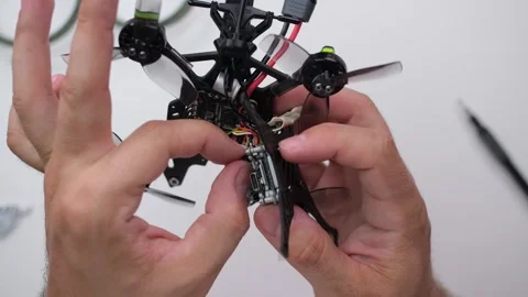 Technical specialist assembly fpv drone screw video transmitter air unit Stock Footage 244336228