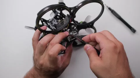 Technical specialist assembly fpv drone screw video transmitter air unit Stock Footage 244336331