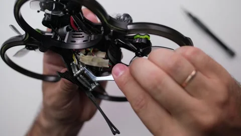 Technical specialist assembly fpv drone screw video transmitter air unit Stock Footage 244336481