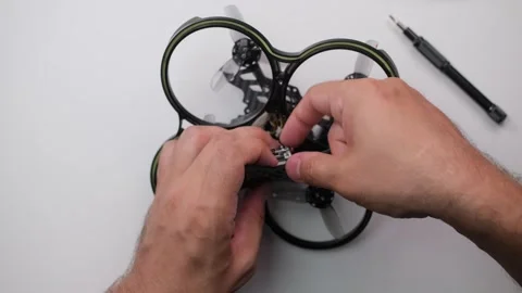 Technical specialist assembly fpv drone screw video transmitter air unit Stock Footage 244336520