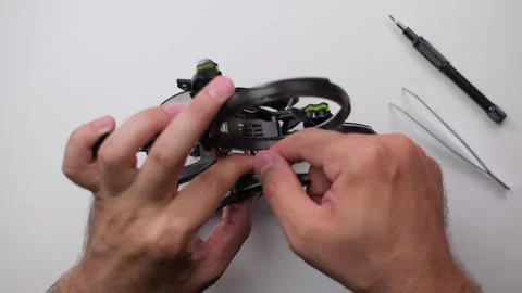 Technical specialist assembly fpv drone screw video transmitter air unit Stock Footage 244337775