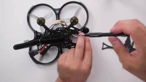 Technical Specialist frame of camera to drone fpv quadrocopter Stock Footage 244335678