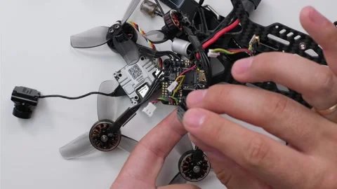 Technical Specialist take apart drone fpv for apply silicone polish waterproof Stock Footage 244333026