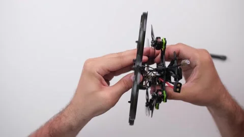 Technical Specialist take apart to repair drone fpv quadrocopter Stock Footage 244331453