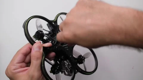 Technical Specialist take apart to repair drone fpv quadrocopter and assembly Stock Footage 244337151