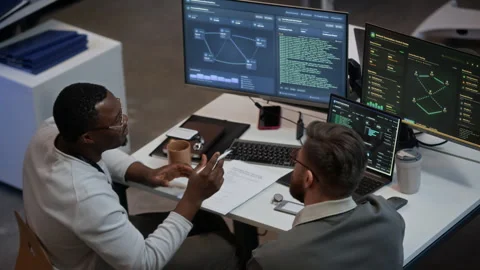 Technical Specialists Analyzing Network System on Computers in Office Stock Footage 334936464