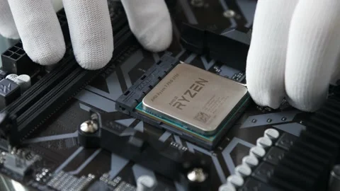 A technical specialist's hands in white gloves removing the CPU from socket Stock Footage 195154543