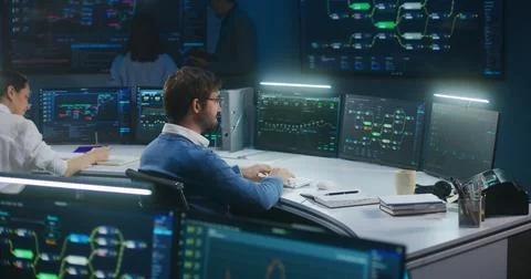 Technical support analyzes server data late night Stock Photos