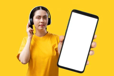 Technical support and hotline. A young Caucasian pretty woman in headphones,  Stock Photos