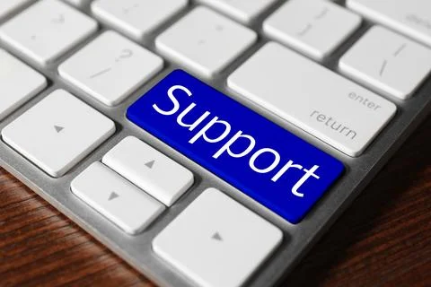 Technical support. Computer keyboard with word on blue button, closeup Stock Photos