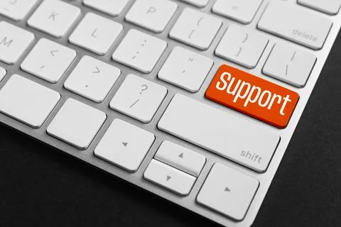 Technical support. Computer keyboard with word on red button, closeup Stock Photos