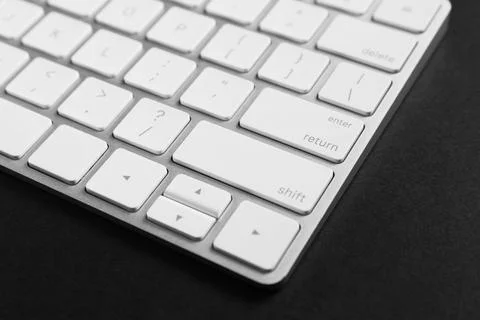 Technical support concept. Modern keyboard on black background, closeup 写真素材