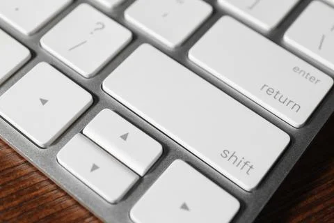 Technical support concept. Modern keyboard on wooden background, closeup Stock-Fotos