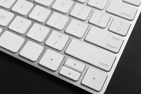 Technical support concept. Modern keyboard on black background, closeup 写真素材