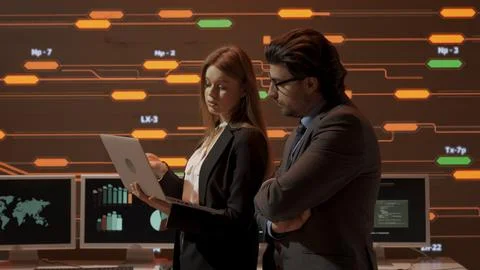 Technical support in control room. IT specialists talking at the security office Stock Photos