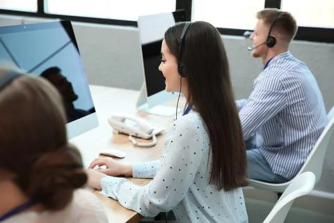 Technical support operator working with colleagues in office Stock Photos