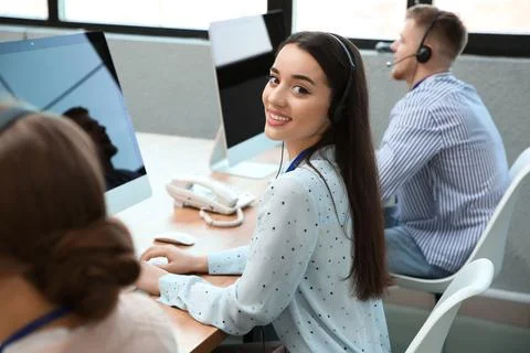 Technical support operator working with colleagues in office Stock Photos