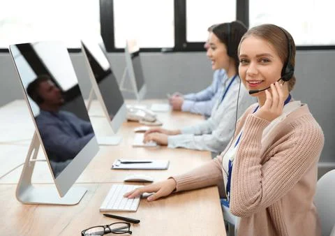 Technical support operator working with colleagues in office Stock Photos