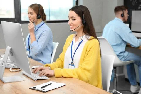 Technical support operator working with colleagues in office Stock Photos