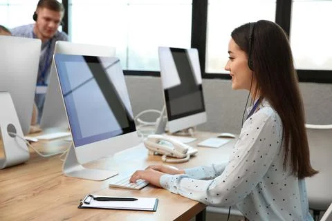 Technical support operator working with colleagues in office Stock Photos