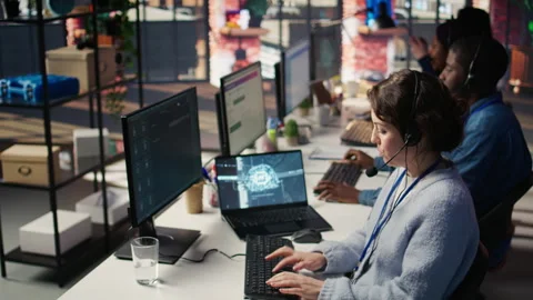 Technical support specialist in call center office using AI chatbot Stock Footage 305403174