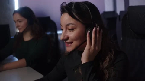 Technical Support Specialist With Headsets Working On Computer In Call Center. Stock Footage 194409778
