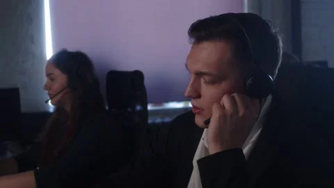 Technical Support Specialist With Headsets Working On Computer In Call Center. Stock-Footage 194410219