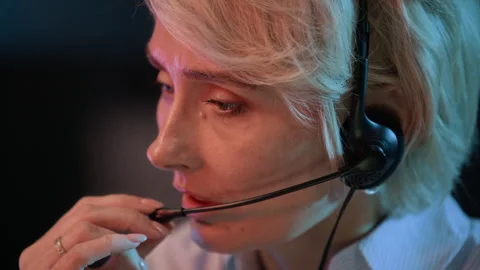 Technical Support Specialist Using Headset while Consulting in Office Stock Footage 334935854