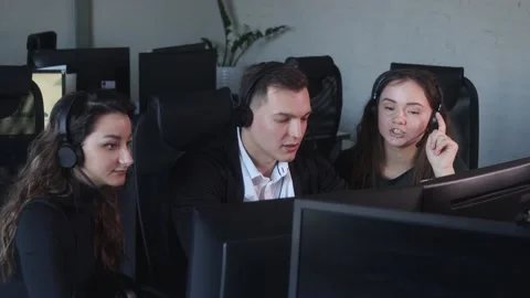 Technical Support Specialists Team Working Together In Call Center Office. Stock-Footage 194410435