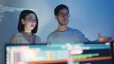 Technical Team Collaborating on Coding Project in Office. Stock Footage 300247094