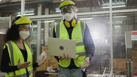 Technical team wears face mask to work laptop to checkup machinery in industrial Stock Footage 159222248