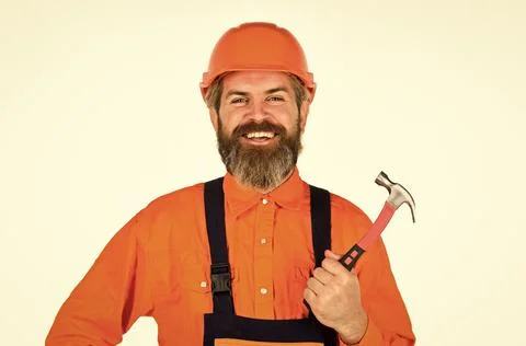 Technical work. Bearded mature man in uniform. Guy with hammer. Good hammer Stock Photos