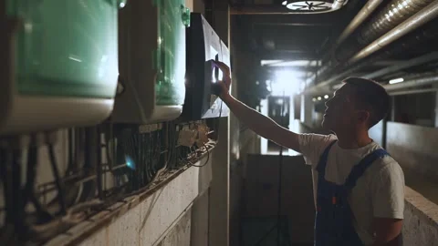 A technical worker at a pig farm, an operator at a pig farm Stock Footage 244234953