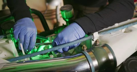 Technician Adjusts Engine Components in Engine Room 스톡 동영상 323739297