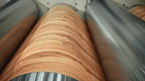 Technician Adjusts Pressure Of Rollers While Ensuring Realistic Wood Grain Stock Footage 337935448