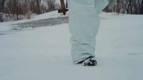 Technician advances cautiously on weak frozen surface. Riskconscious responder Video stock 342742471