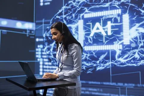 Technician in AI high tech workspace managing call center tasks Stock Photos