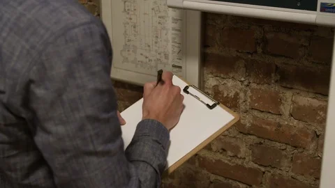 Technician Analyst Noting Something on Clipboard, Reading the Power Consumption 스톡 동영상 118712288