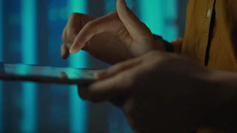 A technician analyzes and tests a server room robot that manages open source Stock Footage 289576554