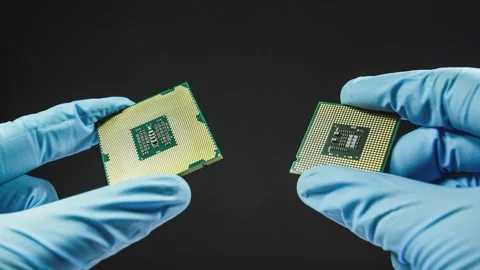 Technician analyzing two microchips for ... | Stock Video | Pond5