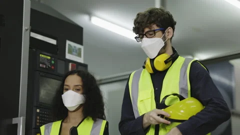 Technician and engineer wearing protective equipment to work in industrial plant Stock Footage 154315795