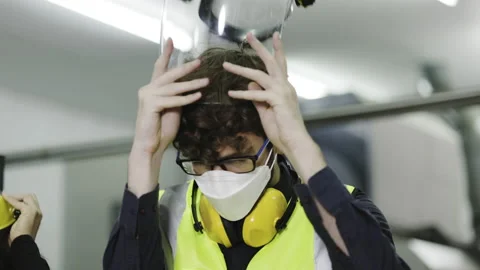 Technician and engineer wearing protective equipment to work in industrial plant Stock Footage 154315889