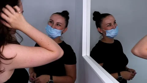 A technician and a model discuss the results of the procedure in front Stock Footage 320083872