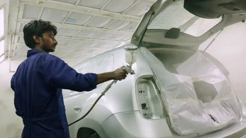 Technician applies fresh layer over vehicle shell Stock Footage 308613012