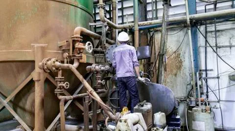 Technician are reparing breakdown machine in factory, Operator are cleaning a Stock Photos