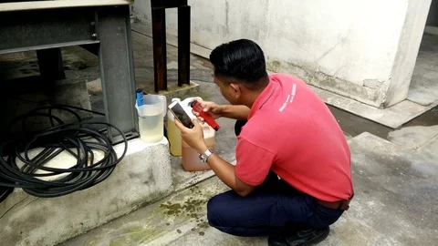 The technician are testing PH water readings Stock Footage 92018628