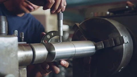 Technician asia worker using vernier caliper measure detail of workpiece Stock Footage 204054597