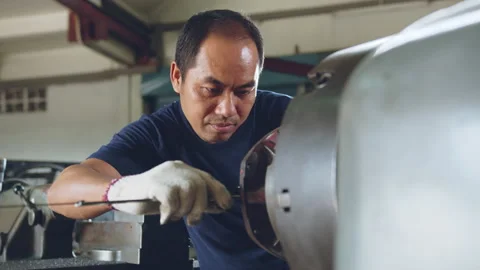 Technician asia worker using vernier caliper measure detail of workpiece Stock Footage 204055028